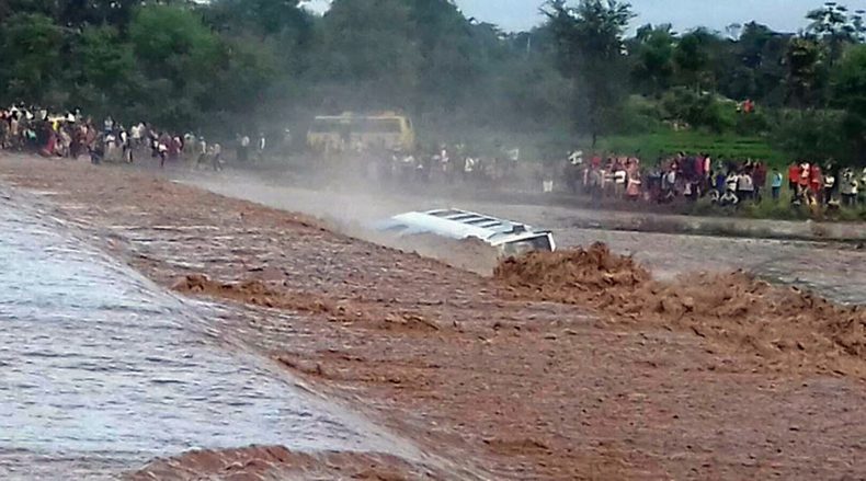 Bus washed by river